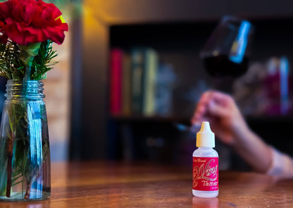 Wine Tamer Acid Reducer Drops with Wine in Background
